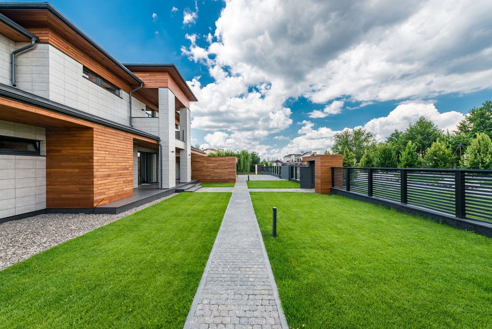 Modern house with a landscaped green yard